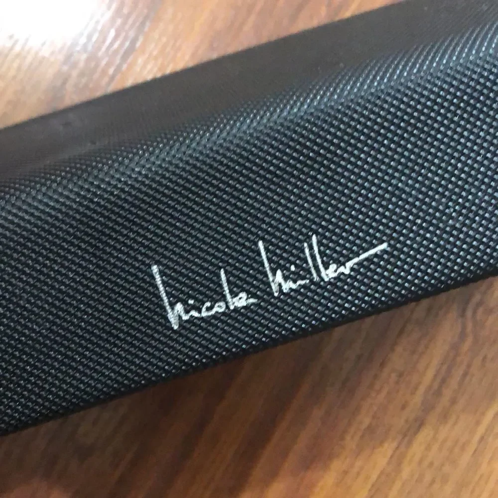 Nicole Miller Black hard triangular eyeglass case.